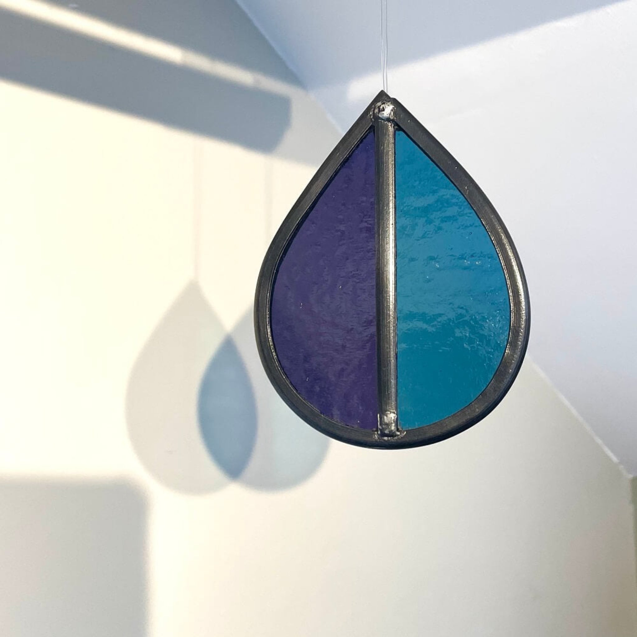 Teardrop-shaped  hanging stained glass garden tree spinner / in house sun catcher, with blue and purple stained glass, 
