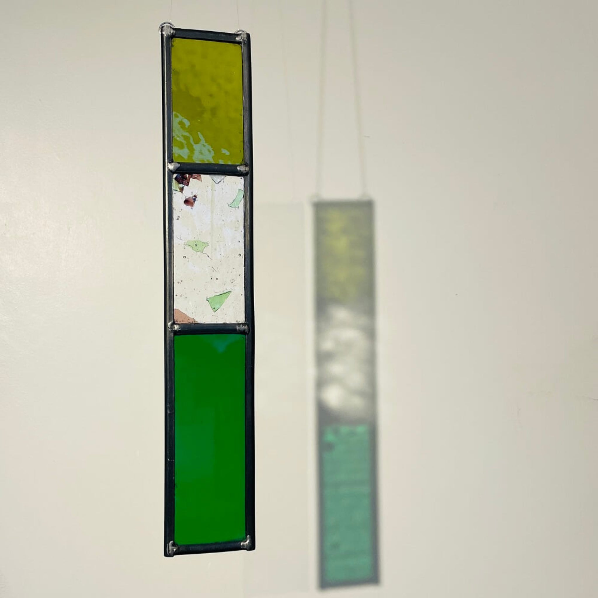 shades of green stained glass garden tree spinner / in house sun catcher, 3 lass sections, rectangle stained glass panel.