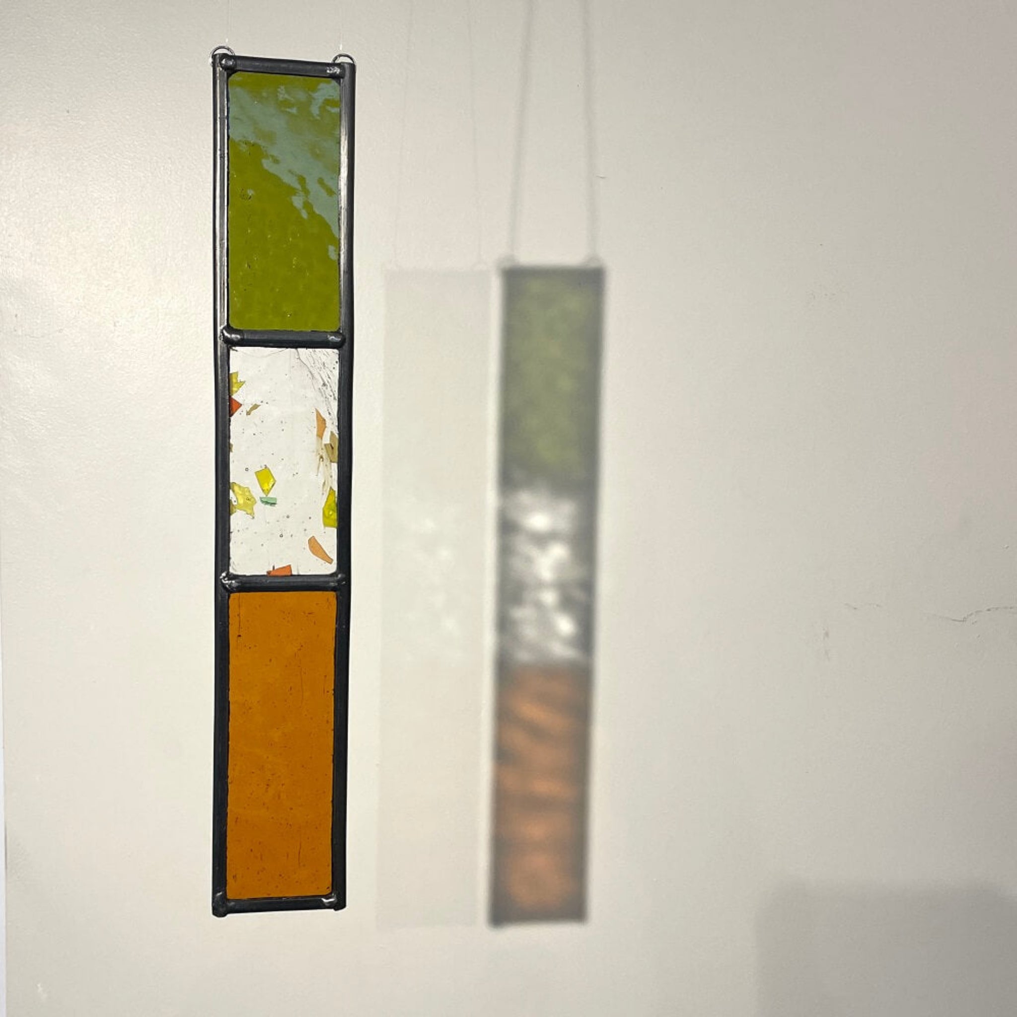green and orange stained glass sun catcher, stained glass garden tree spinner / in house sun catcher, 3 glass sections, rectangle stained glass panel.